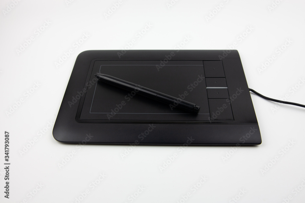 Black graphic tablet for drawing on a white background. A tool for creativity.
