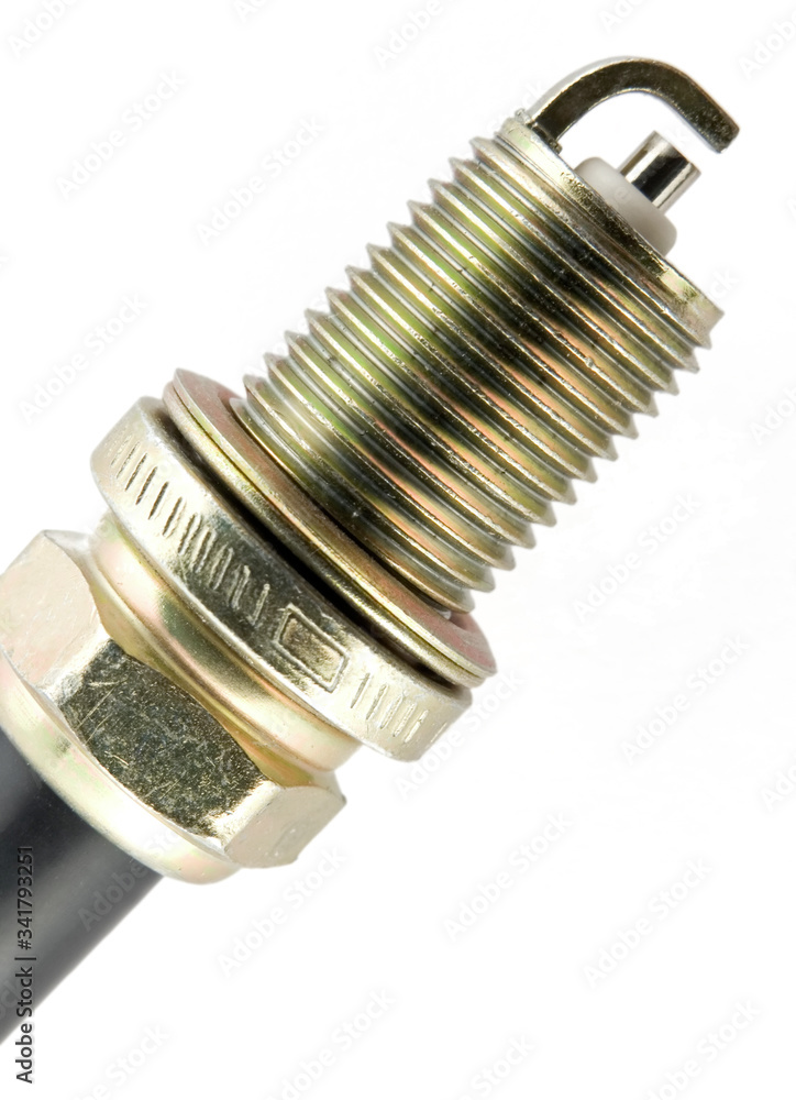A close up of a copper spark plug isolated on white. A close up of a copper spark plug isolated on white.