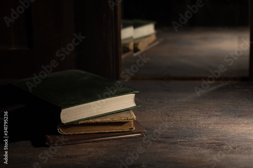 Wallpaper Mural Old books on a wooden table are reflected in an old mirror Torontodigital.ca