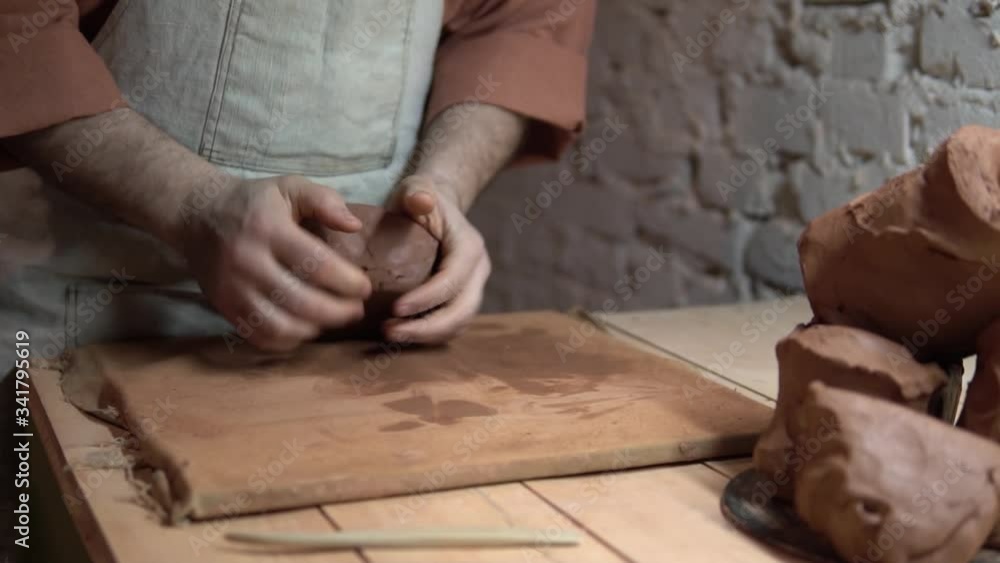pottery making. potter's hands shaping up the terracotta clay pot on wheal. pottery making. potter's hands shaping up the terracotta clay pot on wheal.