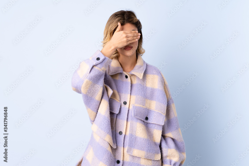 Young Russian woman isolated on blue background covering eyes by hands. Do not want to see something Young Russian woman isolated on blue background covering eyes by hands. Do not want to see something
