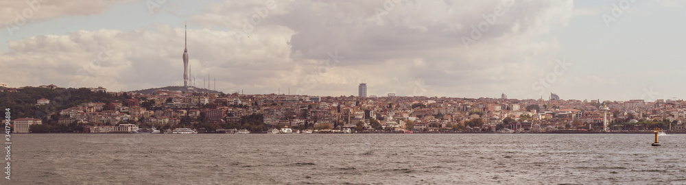 Panoramic view of Istanbul skyline from Bosphorus strait in sepia color