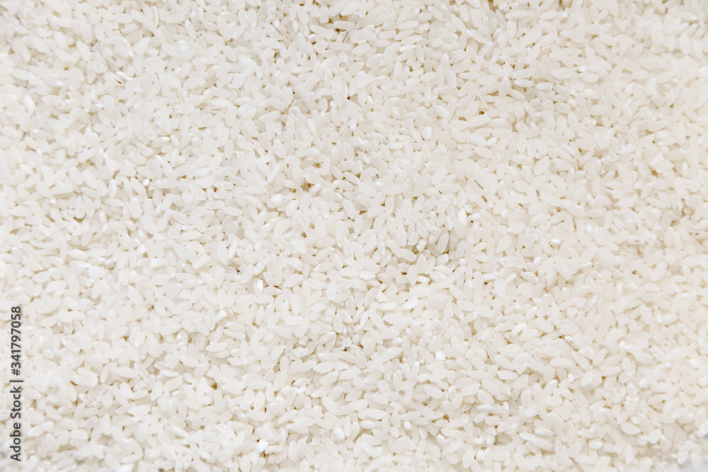 Heap of white glutinous rice close-up as background. Organic white rice, glutinous rice or sticky rice for design nature foods background. Heap of white glutinous rice close-up as background. Organic white rice, glutinous rice or sticky rice for design nature foods background.