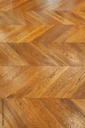 Fragment of brown wooden parquet floor.