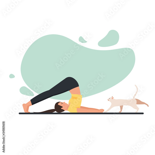 Young beautiful flexible girl doing yoga at home with cat. 