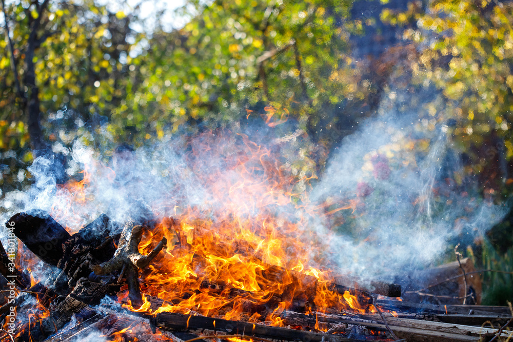 Large smoky bonfire in the garden. Large smoky bonfire in the garden.