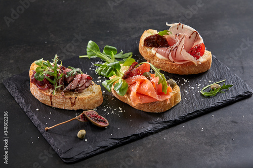 canape with meat  and vegetables photo