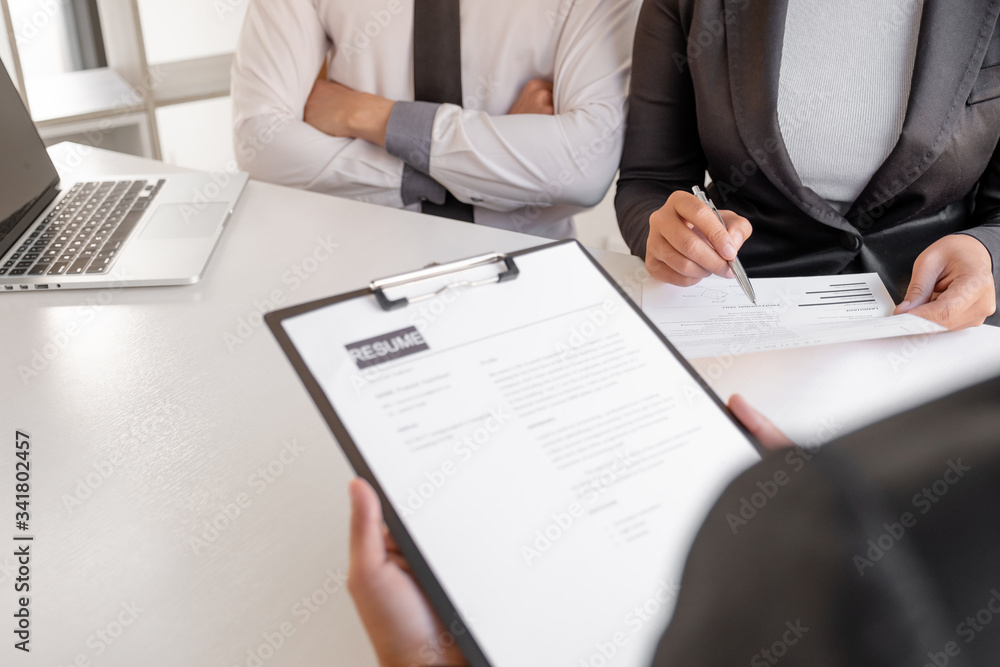 Office executives are interviewing job applicants in the meeting room Office executives are interviewing job applicants in the meeting room