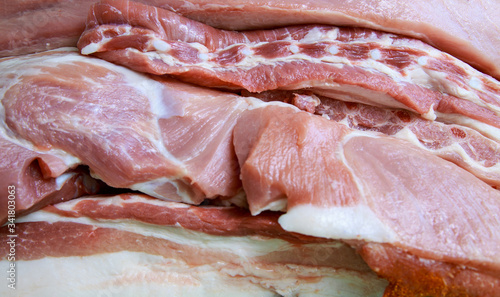 Fresh meat is layered, demonstrates meat production.Pork meat with layers of fat.
