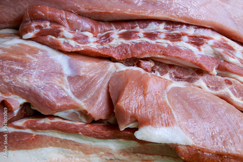 Fresh meat is layered, demonstrates meat production.Pork meat with layers of fat.