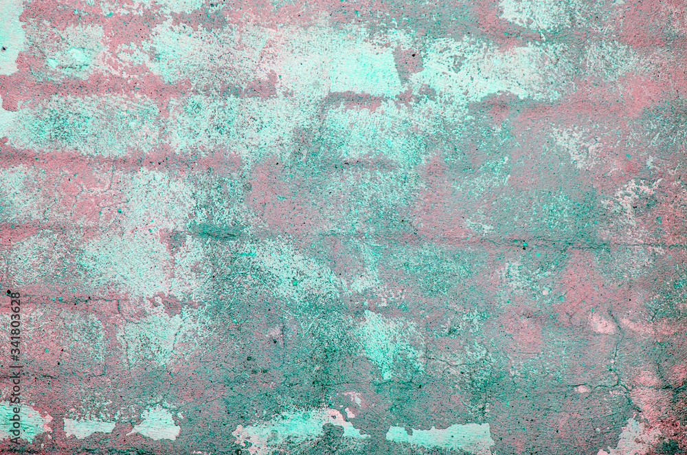 Old brick wall. Peeling plaster on wall of house, building or fence surface.  Toning in bright