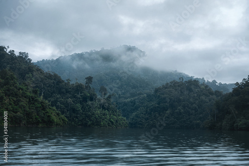 Khao Sok National Park and Cheo Lan Lake. Thailand. Fog on the green heights of the mountains.