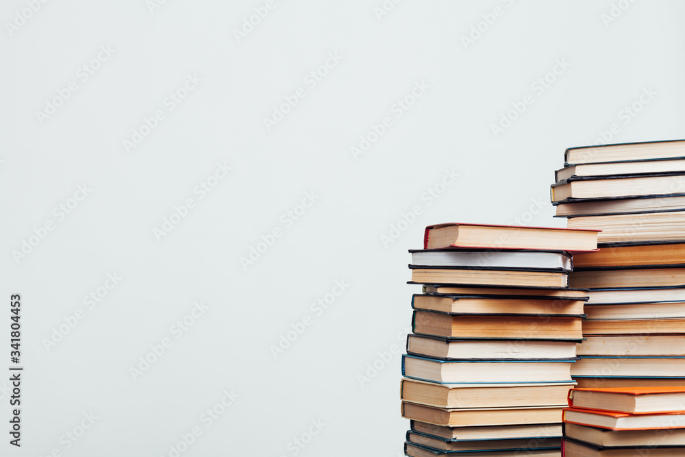 a lot of stacks of educational books in the library on a white background a lot of stacks of educational books in the library on a white background