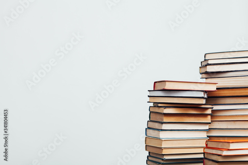 a lot of stacks of educational books in the library on a white background