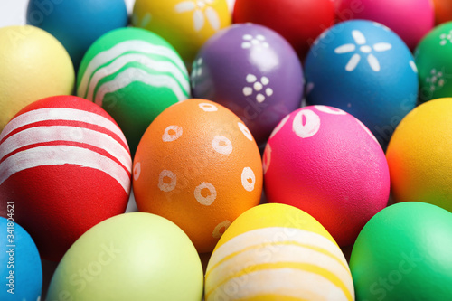 Colorful Easter eggs with different patterns as background  closeup