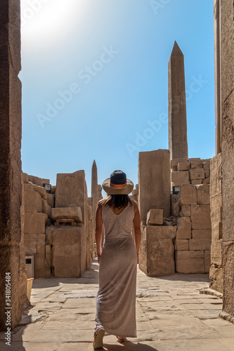 Girl in Egyptian ruins in an ancient temple