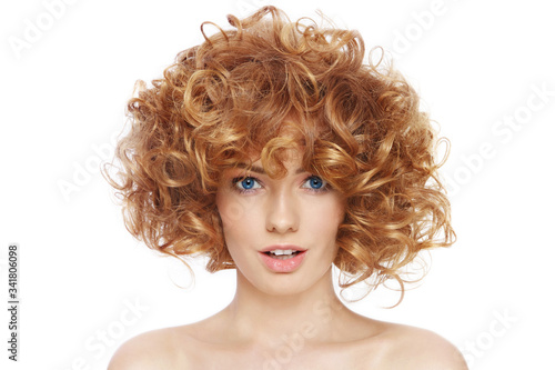 Young beautiful happy woman with curly hair over white background