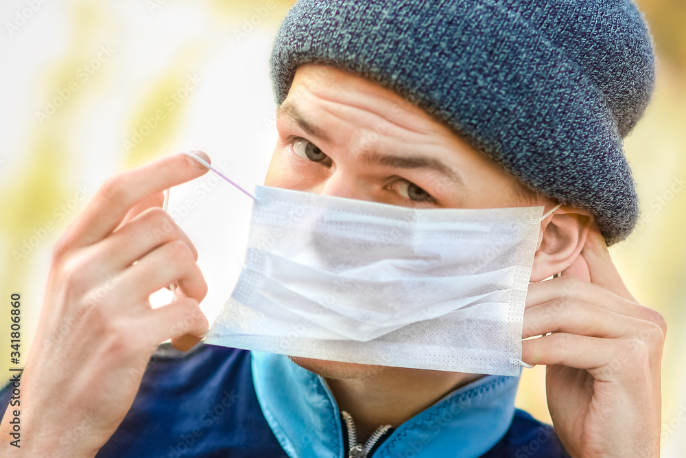 masked man from coronavirus and air. Protection against PM 2.5 air polluted from thea virus in Europe and Asia masked man from coronavirus and air. Protection against PM 2.5 air polluted from thea virus in Europe and Asia