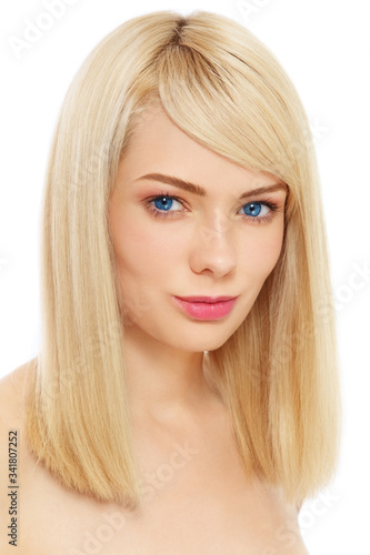 Young beautiful blonde girl with clean make-up over white background