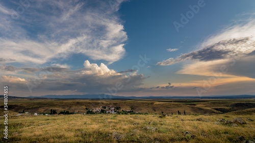 Sunset over the steppe landscape and wonderful clouds