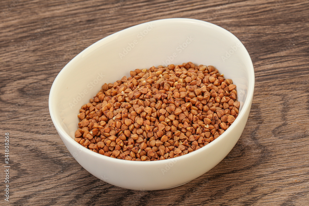 Raw buсkwheat cereal in the bowl Raw buсkwheat cereal in the bowl