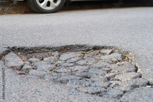 A hole on the asphalt road