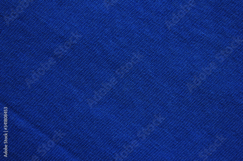 Dark blue fabric texture. Colorful navy blue colour backgrounds. Seamless vivid blue canvas, cotton material backdrop banner. Navy blue tone cloth template