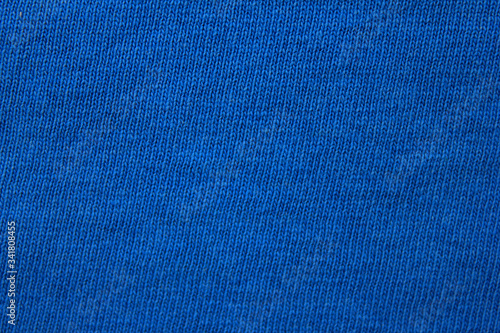 Blue fabric texture background, abstract close-up dark blue color cloth. Empty clothes pattern brochure, blue fabric texture of natural cotton blend