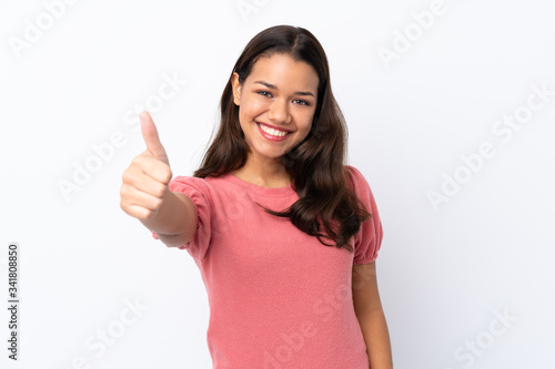 Wallpaper Mural Young Colombian girl over isolated white background with thumbs up because something good has happened Torontodigital.ca