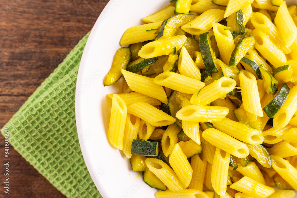 Penne pasta with zucchini and saffron. Penne pasta with zucchini and saffron.