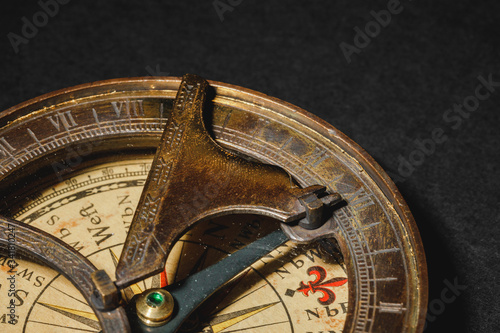 Retro compass on black board background. photo