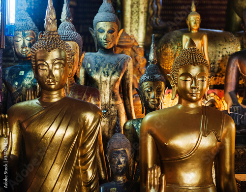 Golden buddhist staues of Wat Mai Suwannaphumaham, Luang Prabang, Loas, Southeast Asia photo