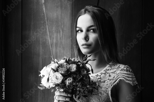 girl holding flowers in hands, young beautiful bride in white dress holding wedding bouquet, bouquet of bride from rose cream spray, rose bush, rose purple Memory Lane, violet eustoma, eucalyptus