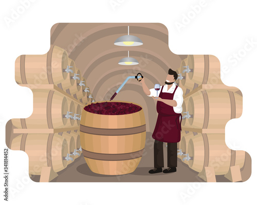 Male winemaker checks wine during fermentation process in large wooden vat at wine cellar with oak barrels