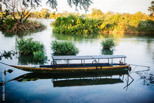 Slow boat docked on Don Det Island in the Mekong River, , four thousand islands, Si Phan Don, Laos, Southeast Asia photo