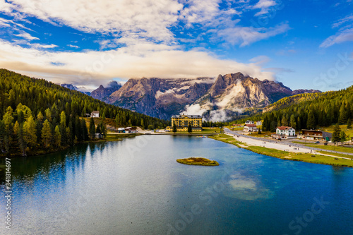 Lake Misurina or Lago di Misurina Italy. Misurina Lake with perfect sky reflection in calm water. Stunning view on the majestic Dolomites Alp Mountains, Italy, National Park Tre Cime di Lavaredo. photo