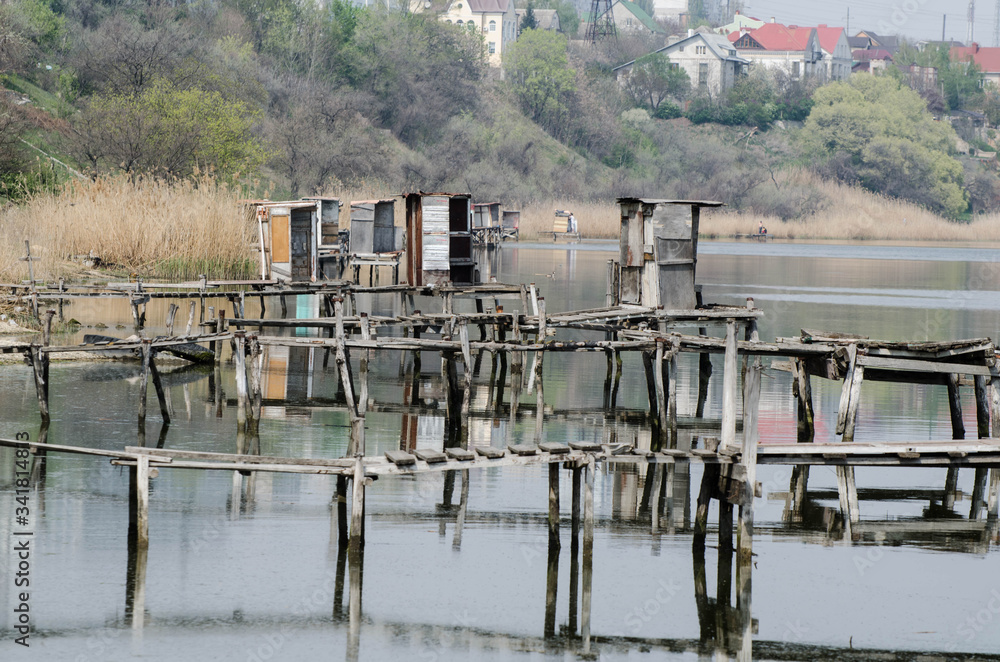 River bank. Jetty for fishing. Fishermen by the river River bank. Jetty for fishing. Fishermen by the river