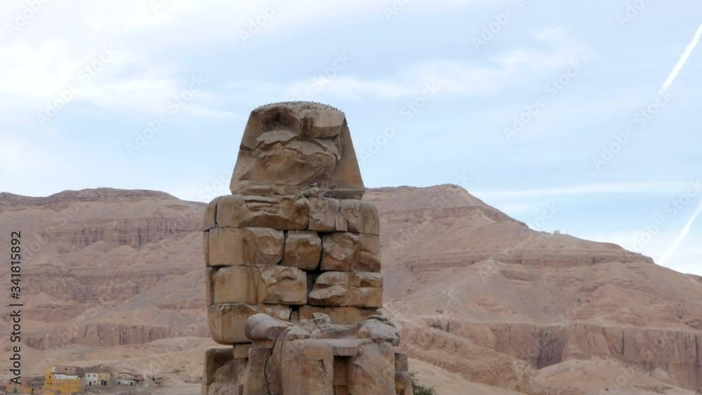 The Colossi of Memnon are two Massive Ancient Statue Carry an