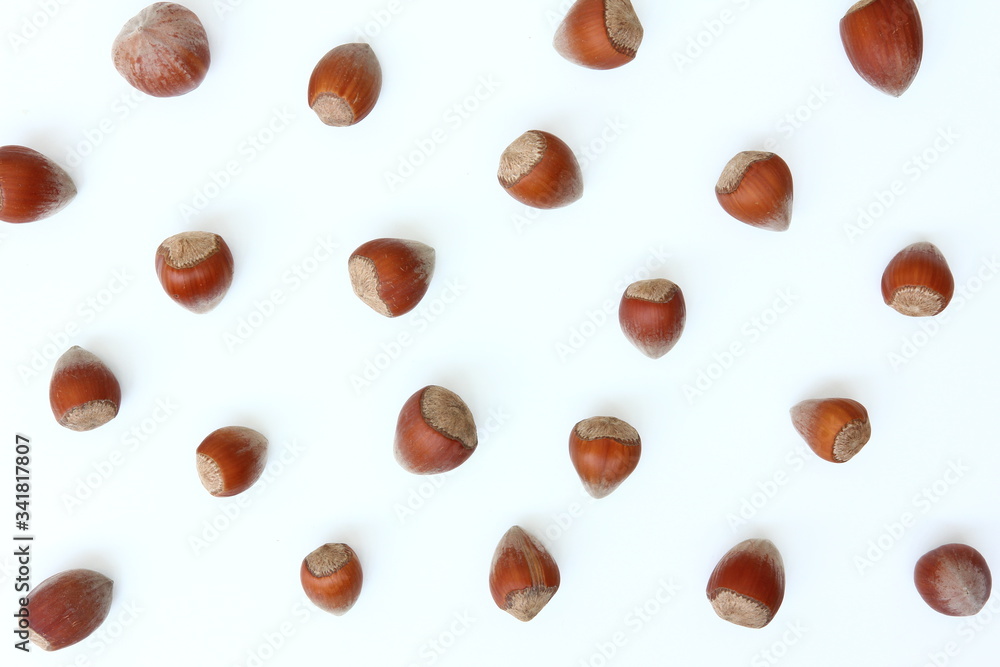 Superfoods - Nuts - Hazelnuts on white background Superfoods - Nuts - Hazelnuts on white background