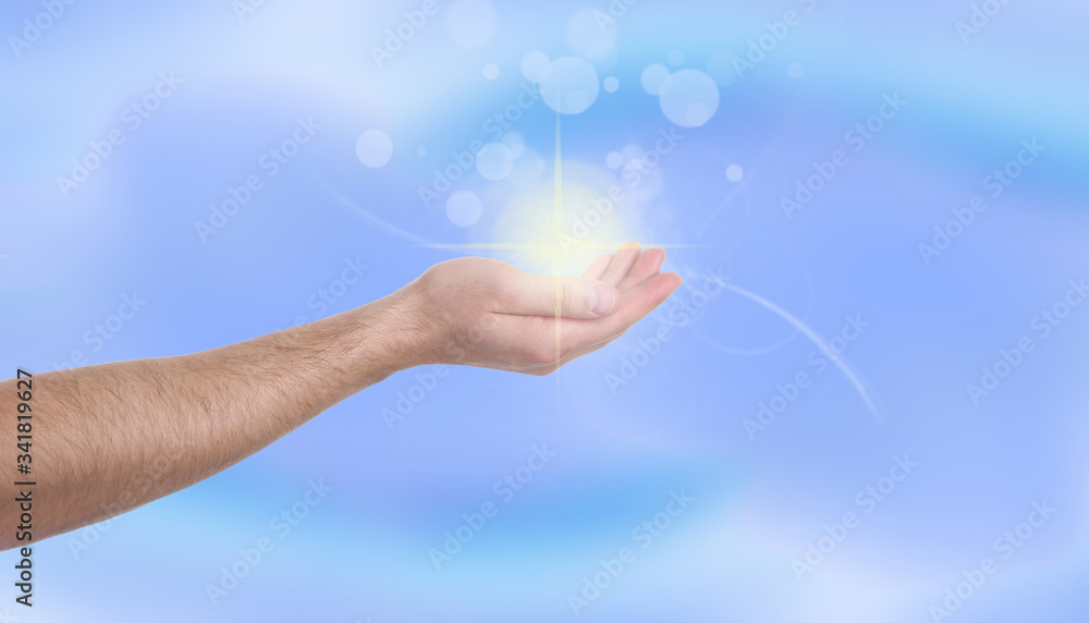 Man holding concentrated healing energy in his hand, closeup Man holding concentrated healing energy in his hand, closeup