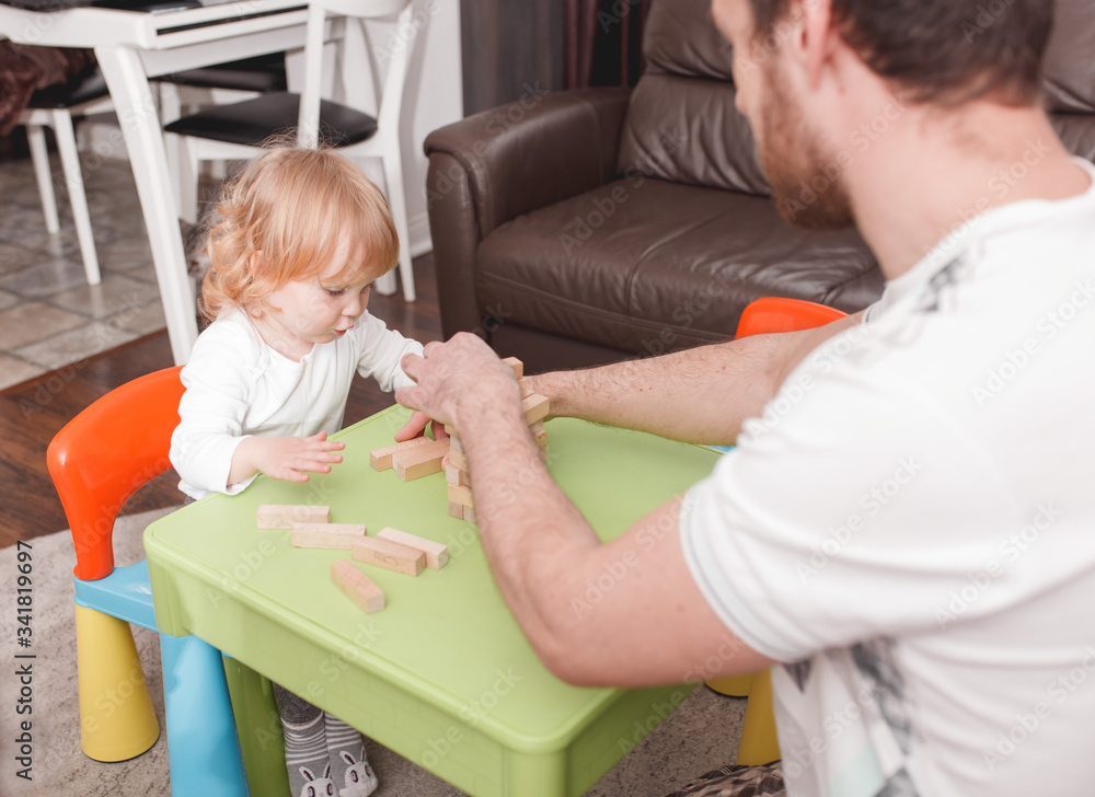 Fototapeta premium Father's day. Daddy Spend Time with children. Happy Holiday. Father plays with children. Spending time at home.