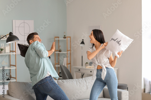 Happy young couple fighting...