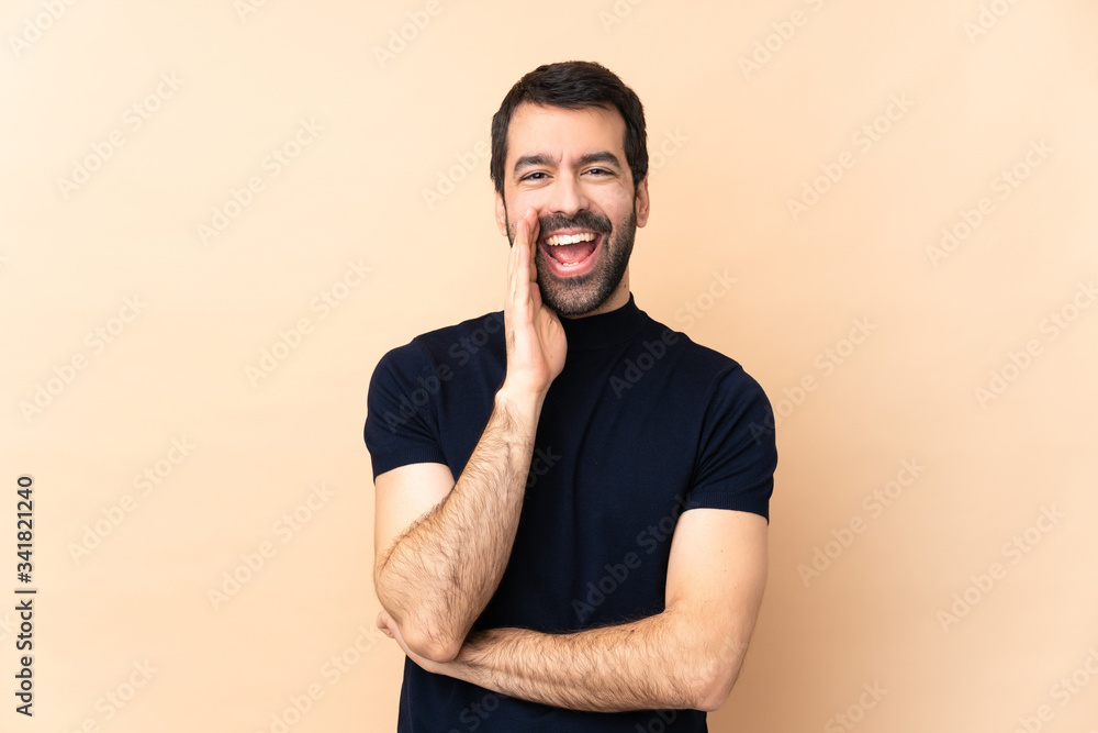 Caucasian handsome man over isolated background shouting with mouth wide open Caucasian handsome man over isolated background shouting with mouth wide open