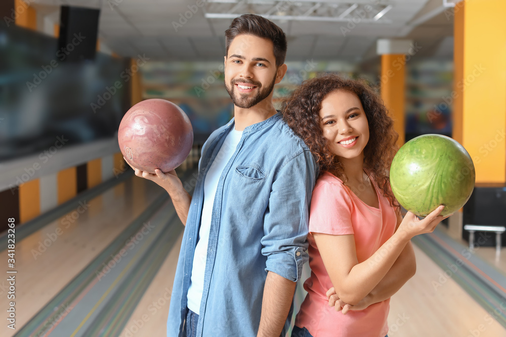 Fototapeta premium Friends spending time in bowling club