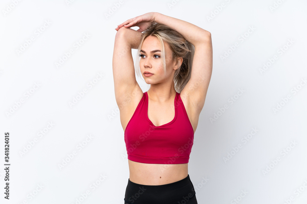 Teenager girl holding waffles over isolated blue background stretching Teenager girl holding waffles over isolated blue background stretching