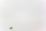 Flag of Ukraine on a background of gray sky