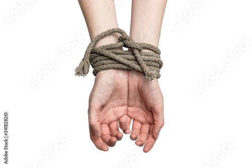Billede på lærred The white woman's hands are tied with an old rope