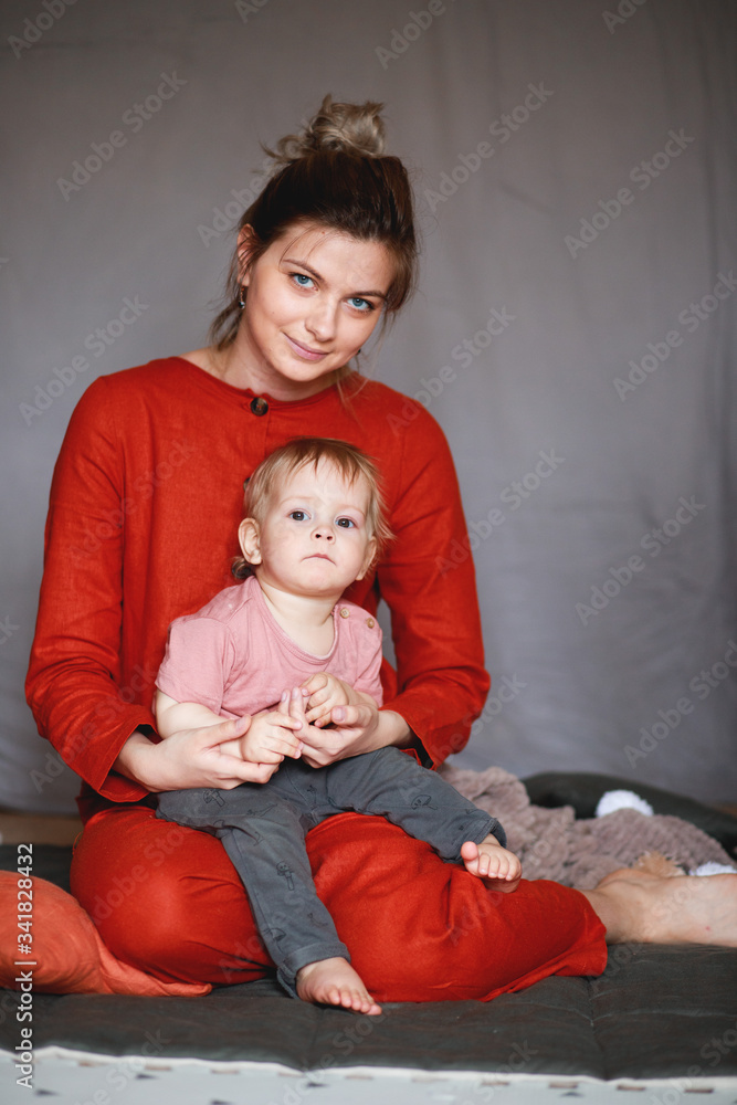 A young mother with her one-year-old little son
