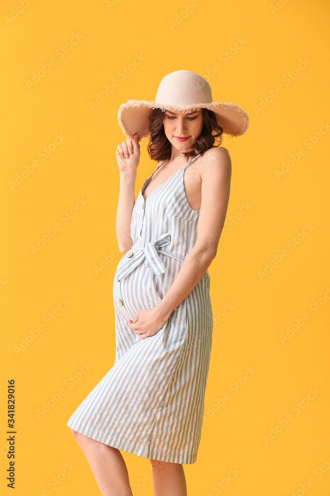 Beautiful pregnant woman on color background Beautiful pregnant woman on color background