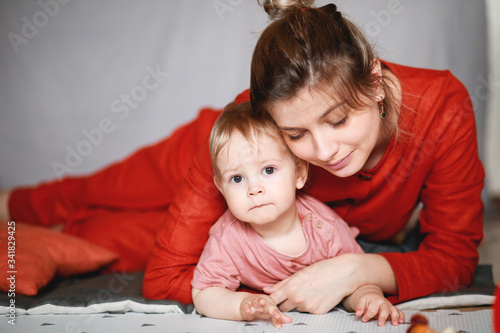 A young mother with her one-year-old little son